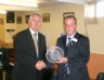 Club Chairman Brian O'Neill accepts a commemorative GAA 125 Award on behalf of the club from Christy Cooney 