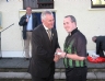 Christy Cooney presents referee Francis Traynor with his commemorative medal 